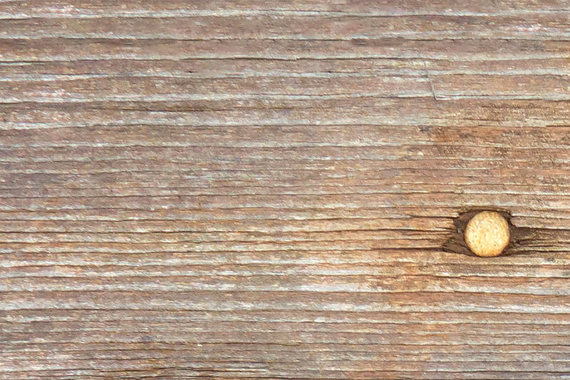 Close-up of weathered timber deck boards ready for oiling